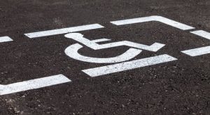 White handicap marking on asphalt on the roadway